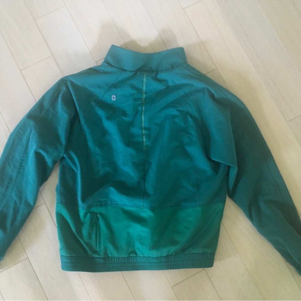 FIGS Sydney Scrub Jacket in a hunter green color - Picture 11 of 13